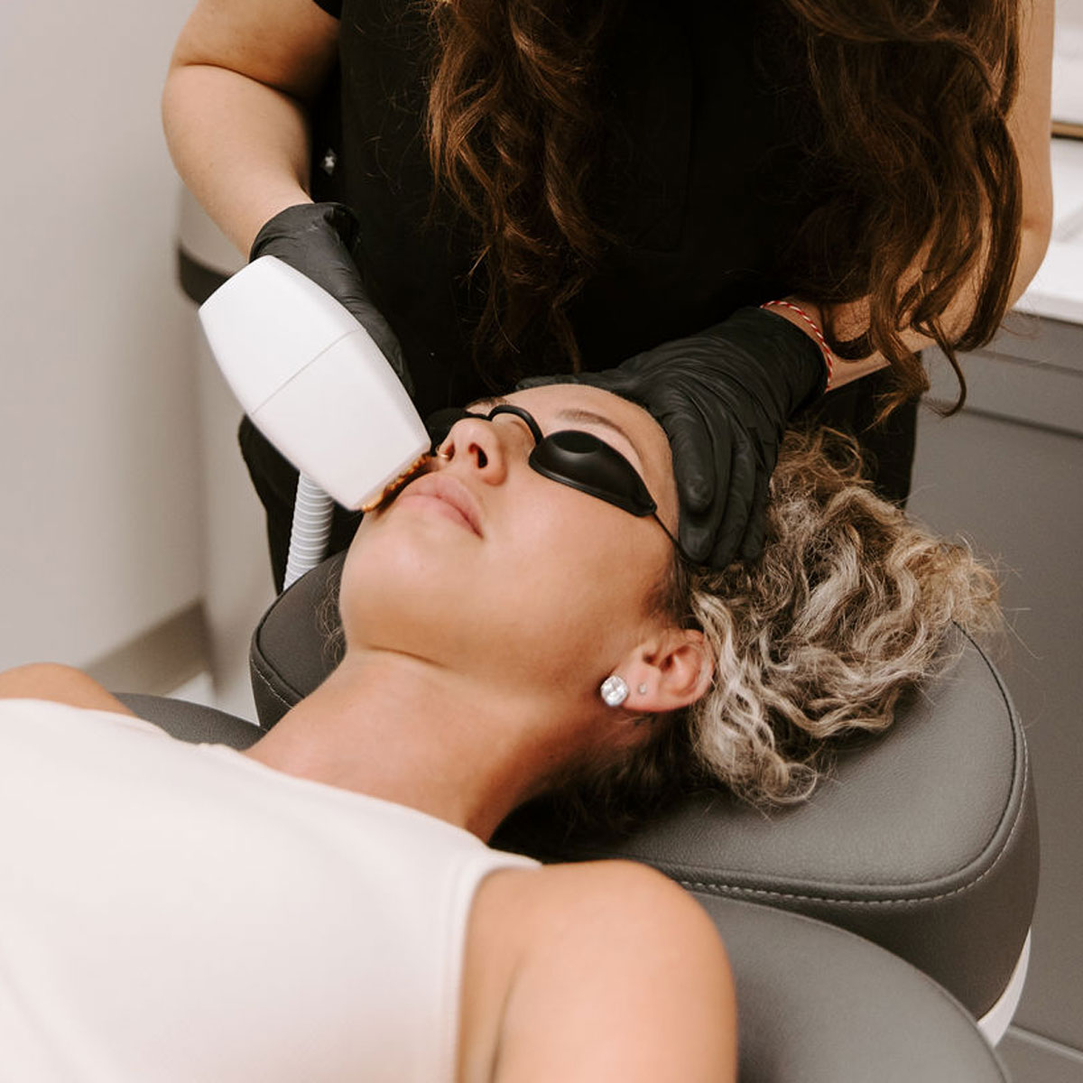 woman receiving laser hair removal clearwater